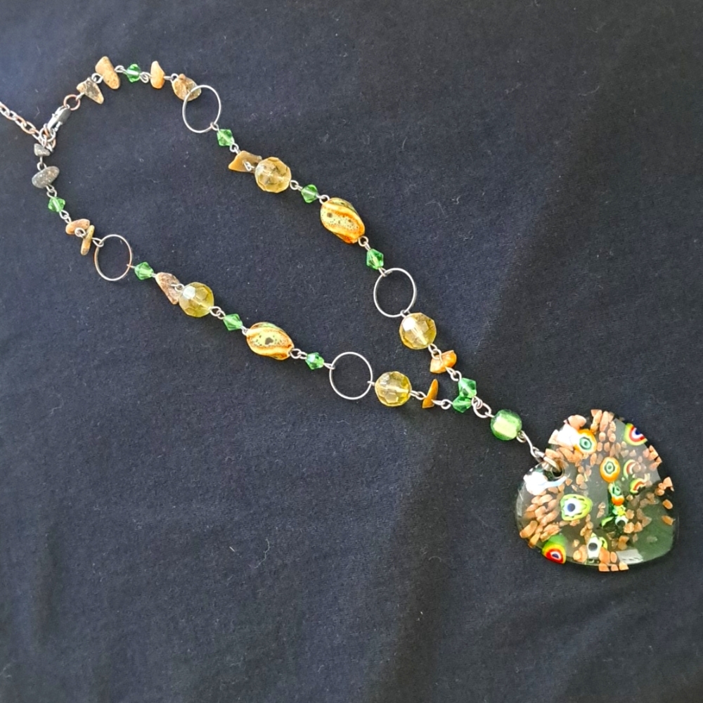 12 inch glass heart necklace. Multi colors .  With small stones and glass beads.